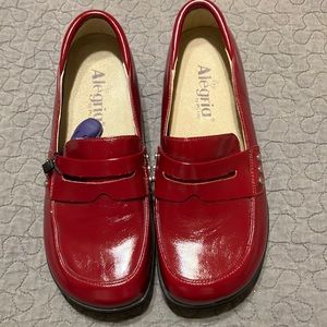 Penny loafer style slip on shoe.